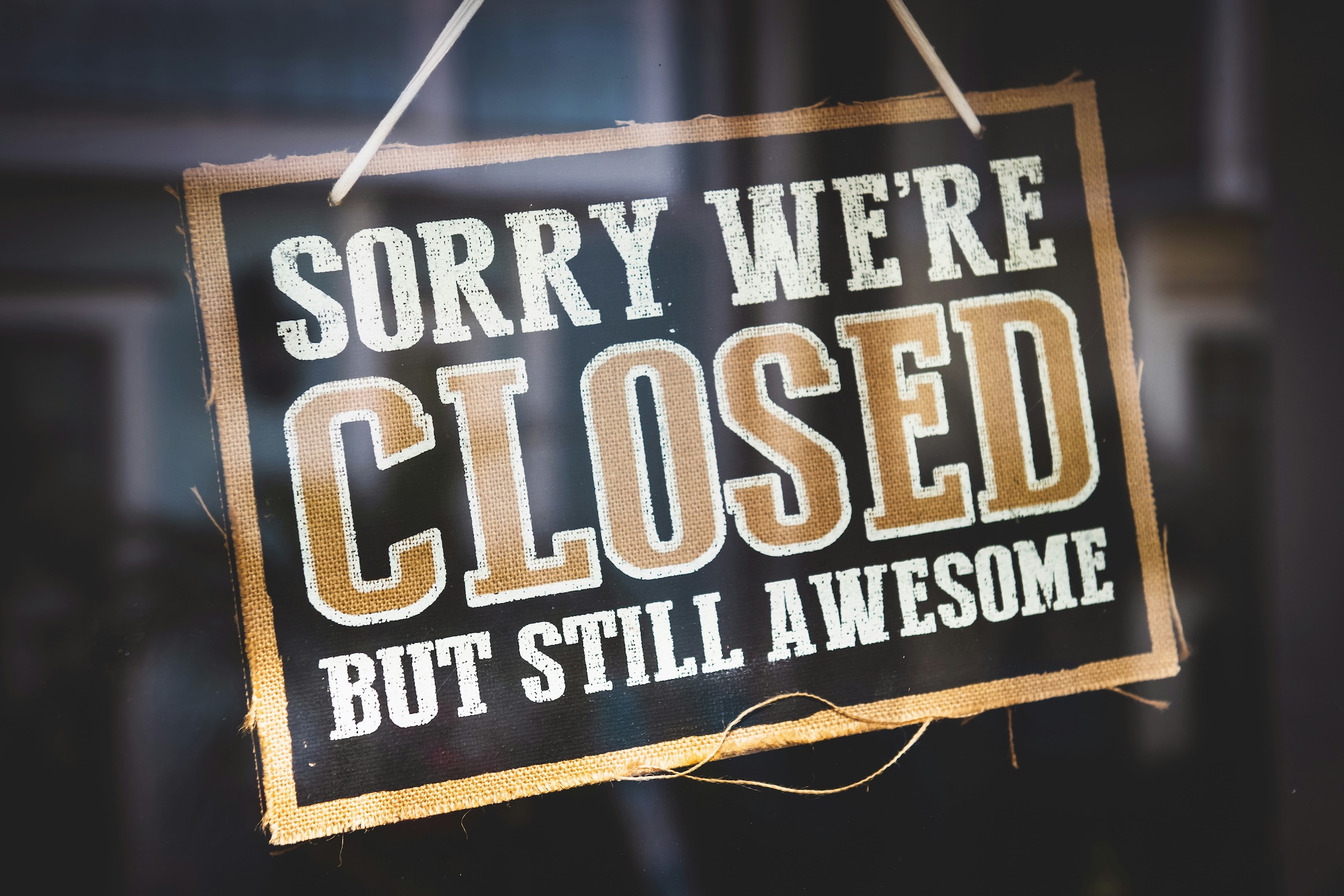 Sign stating "sorry, we're closed but still awesome"