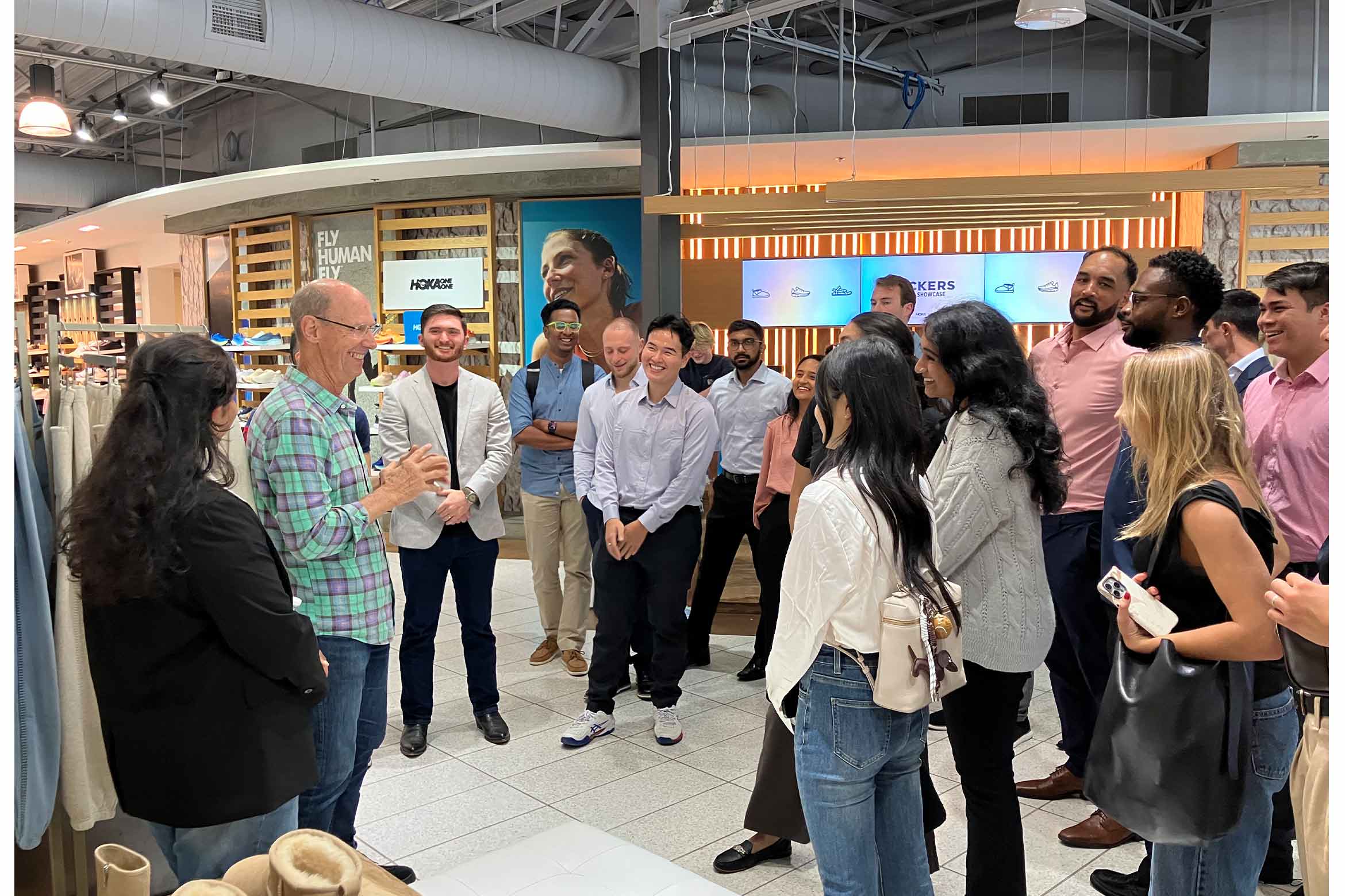 An amused group of people looking at a person who shared a story.