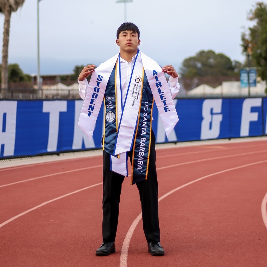 A photo of Justin with Graduation Stolls on the track