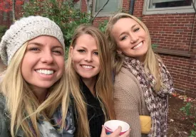 kelly takes a selfie with two other girls