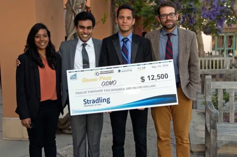 Kyle Neumann, Rahul Sangodkar, Edixon Puglisi and Anjana Krishnan with their $12,000 check