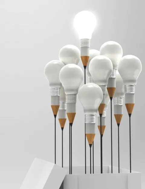 a group of lightbulbs coming out of a box, they are all unlit except for one that juts out at the top
