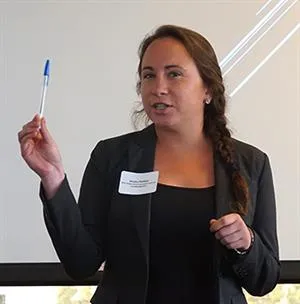 jessica holding a pen making a presentation