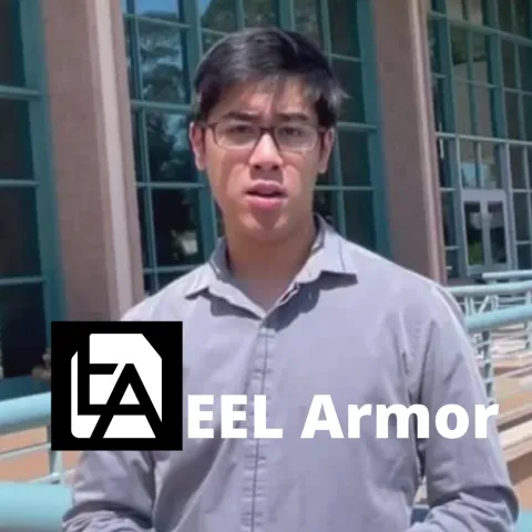 Student speaking in front of engineering building about startup, Eel Armor.