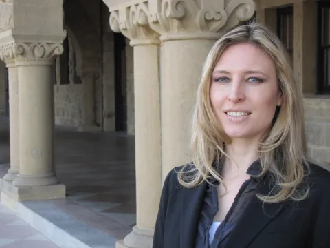 Jessica Santana standing in front of building at Stanford University.