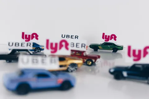 Toy cars labeled with Lyft and Uber